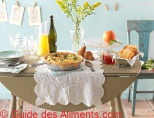 Brunch table set up With Quiche grapefruit and prosecco
